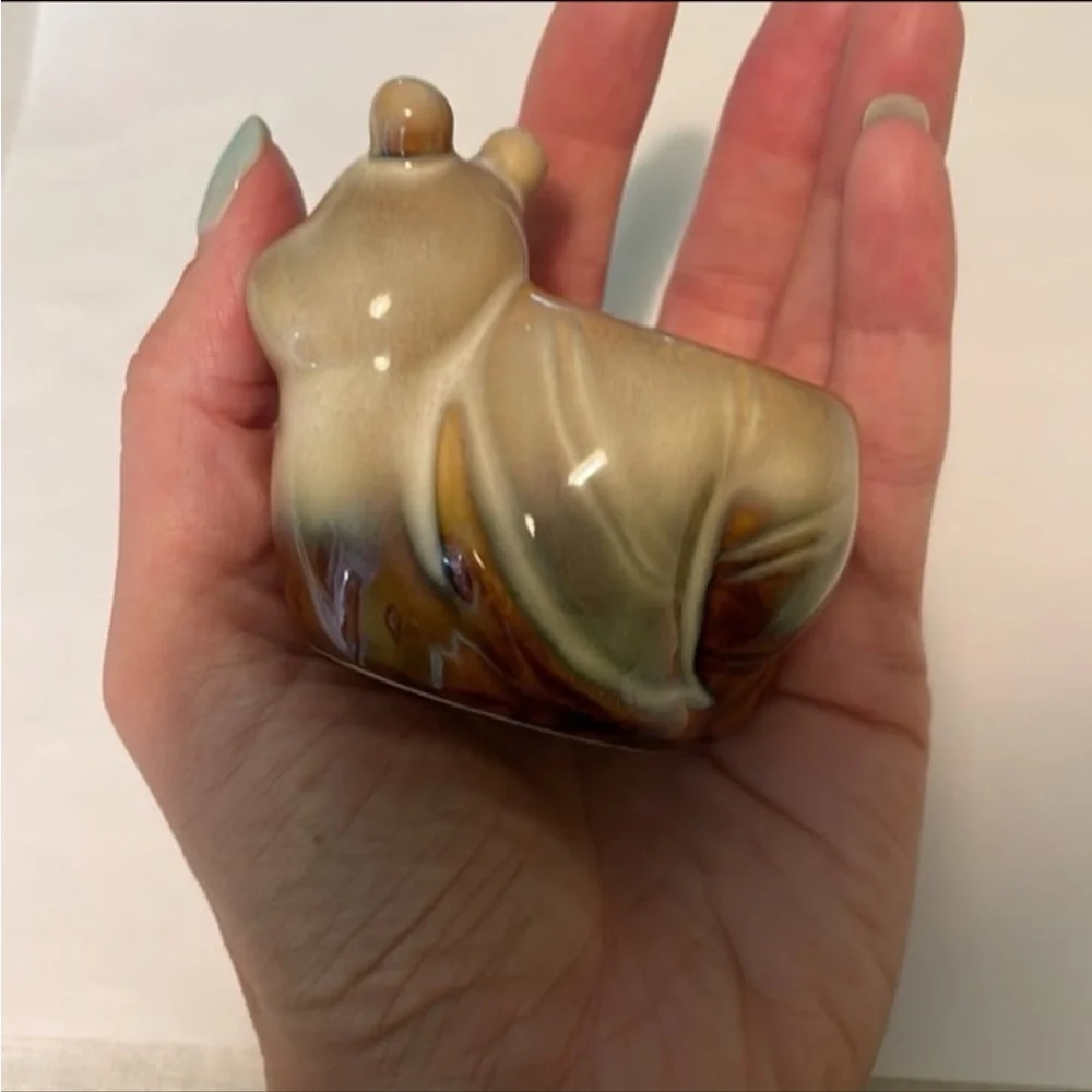 Vintage cottagecore ceramic smiling snail candle